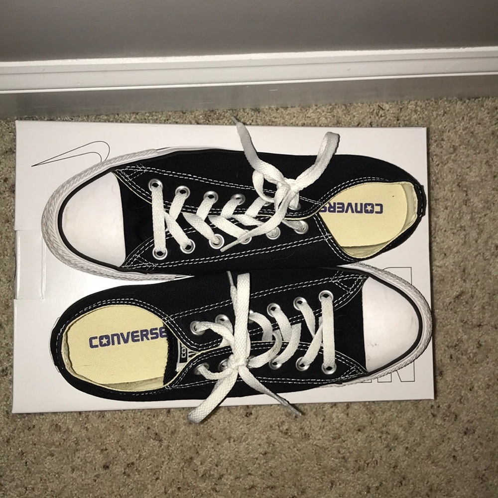 Black Chuck Taylor Converse.